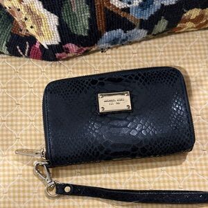 Michael kors zip wallet.